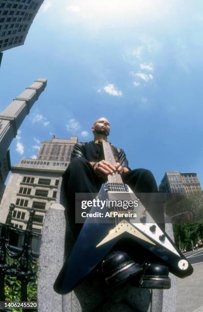 Guitarist C.J. Pierce of the band Drowning Pool appears in a portrait with his Gibson Flying V model guitar on May 10, 2001 in the Flatiron District...