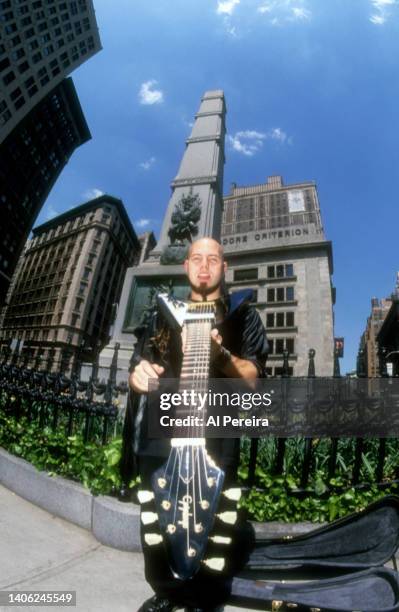 Guitarist C.J. Pierce of the band Drowning Pool appears in a portrait with his Gibson Flying V model guitar on May 10, 2001 in the Flatiron District...