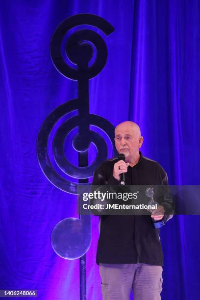 Peter Gabriel receives the O2 Silver Clef Award on stage during the Nordoff Robbins O2 Silver Clef Awards at The Grosvenor House Hotel on July 01,...