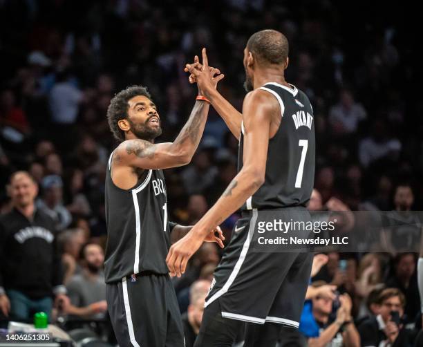 Brooklyn Nets' Kyrie Irving and Kevin Durant celebrate in the 4th quarter while playing the Cleveland Cavaliers at the Barclays Center in Brooklyn,...