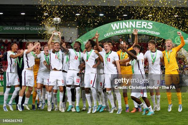 Harvey Vale of England lifts the UEFA European Under-19 Championship Trophy following their sides victory after the UEFA European Under-19...