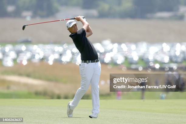 Matt Jones of Punch GC plays an approach shot on the first hole during day two of the LIV Golf Invitational - Portland at Pumpkin Ridge Golf Club on...