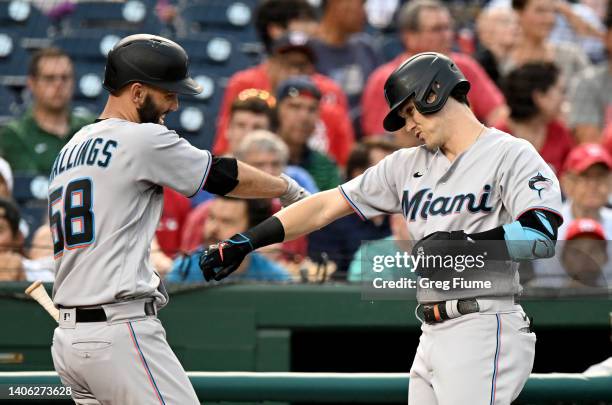 Brian Anderson of the Miami Marlins celebrates with Jacob Stallings after hitting a home run in the third inning against the Washington Nationals at...