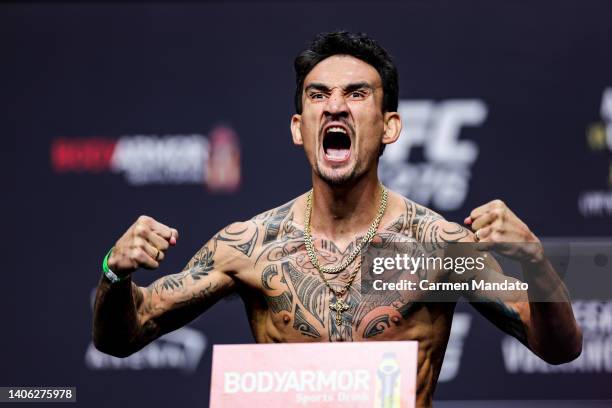 Max Holloway poses on the scale during the UFC 276 ceremonial weigh-in at T-Mobile Arena on July 01, 2022 in Las Vegas, Nevada.