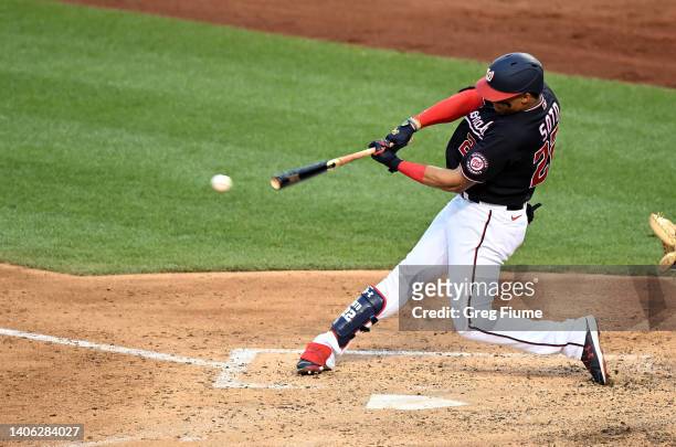 Juan Soto of the Washington Nationals hits a double in the sixth inning against the Miami Marlins at Nationals Park on July 01, 2022 in Washington,...