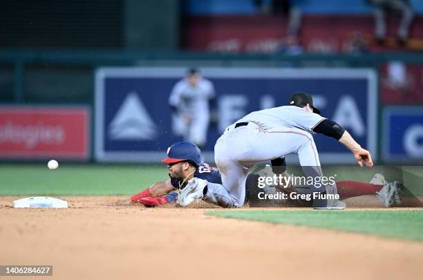 Luis Garcia of the Washington Nationals steals second base in the seventh inning against Joey Wendle of the Miami Marlins at Nationals Park on July...