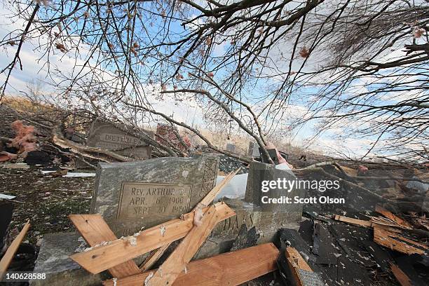 Debris and broken headstones litter the Mt. Moriah cemetery after it was hit by a tornado March 3, 2012 in Henryville, Indiana. Dozens of people were...