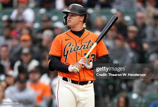 Joc Pederson of the San Francisco Giants reacts after he was called out on strikes against the Chicago White Sox in the bottom of the first inning at...