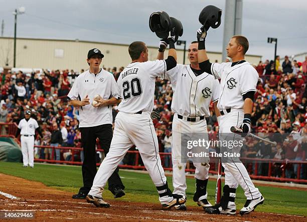 South Carolina's LB Dantzler celebrates his home run with teammates Joey Pankake and Kyle Martin in the second inning against Clemson at Carolina...