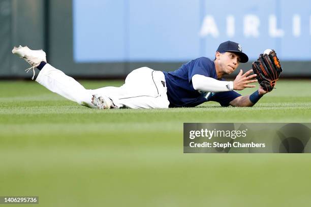 Sam Haggerty of the Seattle Mariners makes a diving catch on a ball hit by Nick Allen of the Oakland Athletics during the fifth inning at T-Mobile...