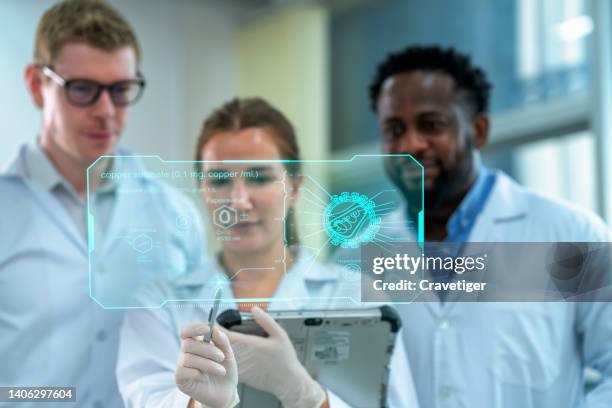 female scientist had presented the result of status of testing reports to her cooperation teamwork at laboratory by use digitization display. - digitization stock pictures, royalty-free photos & images