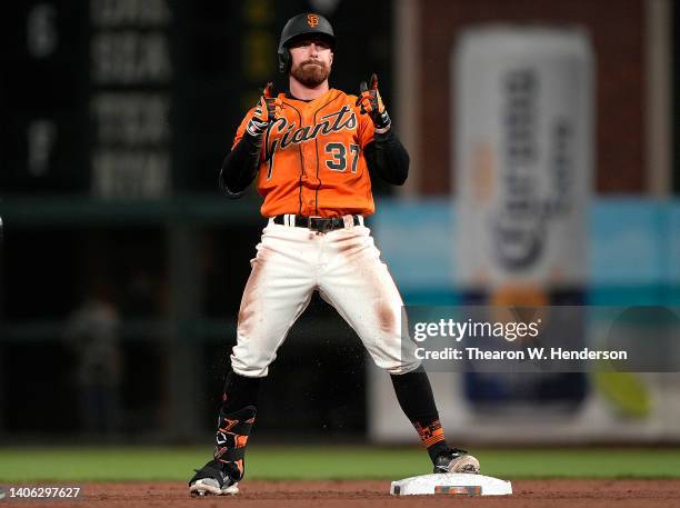 Donovan Walton of the San Francisco Giants celebrates while standing on second base after he hit a double against the Chicago White Sox in the bottom...