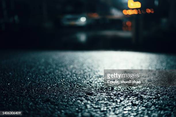 asphalt road after rain - paved driveway stock-fotos und bilder