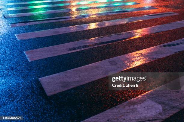 asphalt road after rain at night - wet asphalt stock pictures, royalty-free photos & images