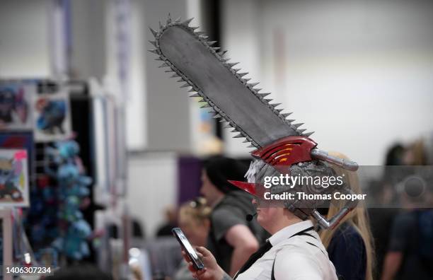 Fan wears a chainsaw helmet on day one of FanExpo Denver 2022 at Colorado Convention Center on July 01, 2022 in Denver, Colorado.
