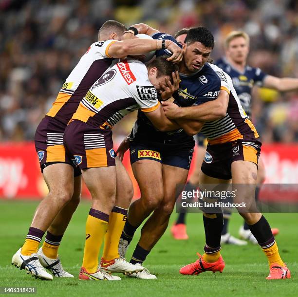 Jordan McLean of the Cowboys is tackled during the round 16 NRL match between the North Queensland Cowboys and the Brisbane Broncos at Qld Country...