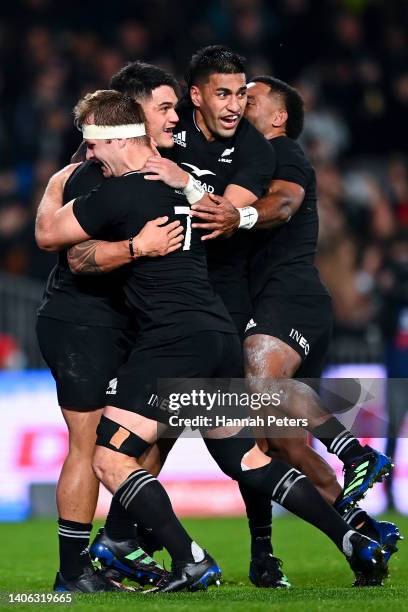 To R, Sam Cane, Quinn Tupaea, Rieko Ioane and Sevu Reece of New Zealand celebrate Tupaea's try during the International test Match in the series...