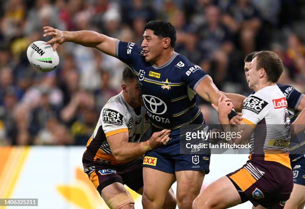Jason Taumalolo of the Cowboys gets a pass away during the round 16 NRL match between the North Queensland Cowboys and the Brisbane Broncos at Qld...