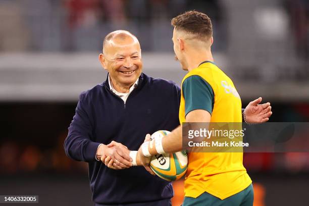 England coach Eddie Jones shakes hands with Nic White of the Wallabies during the warm-up before game one of the international test match series...