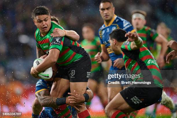 Latrell Mitchell of the Rabbitohs is tackled during the round 16 NRL match between the South Sydney Rabbitohs and the Parramatta Eels at Stadium...