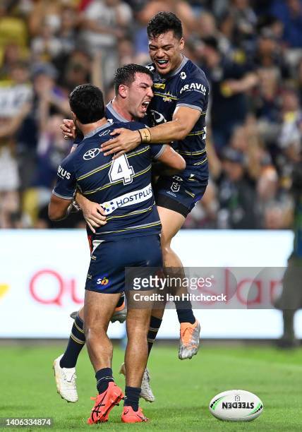 Reece Robson of the Cowboys celebrates after scoring a try during the round 16 NRL match between the North Queensland Cowboys and the Brisbane...