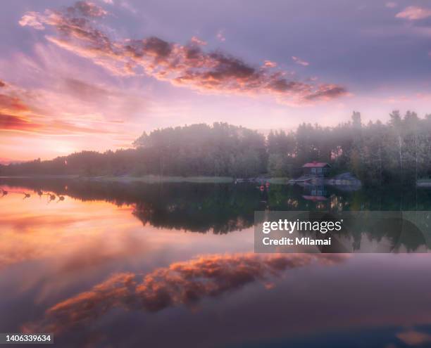 a wooden sauna cabin and beach surrounded by beautiful foggy sea views, archipelago scenery. pink sunrise. rymattyla, naantali, turku, finland. northern europe. - フィンランド文化 ストックフォトと画像