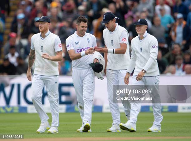 James Anderson of England celebrates taking his fifth wicket with team mates Ben Stokes, Stuart Broad and Matthew Potts during the second day of the...