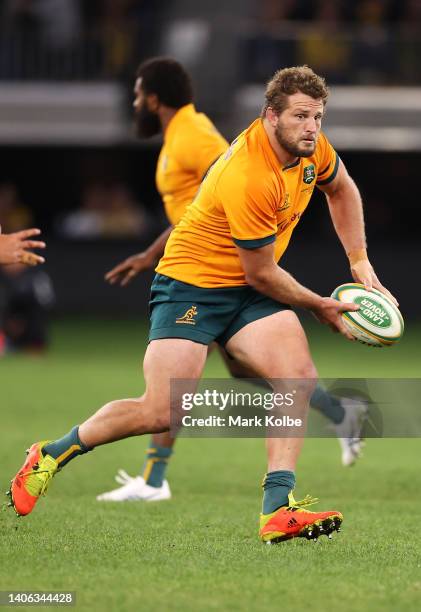 James Slipper of the Wallabies passes during game one of the international test match series between the Australian Wallabies and England at Optus...