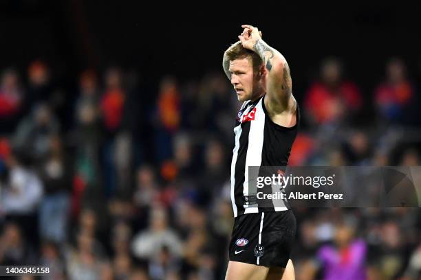 Jordan De Goey of the Magpies looks on during the round 16 AFL match between the Gold Coast Suns and the Collingwood Magpies at Metricon Stadium on...