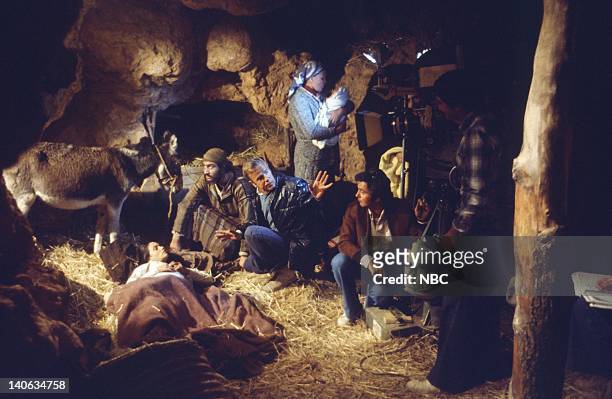 Pictured: Olivia Hussey as Mary, the mother of Jesus, Yorgo Voyagis as Joseph, director Franco Zeffirelli, crew during the manger/nativity scene of...