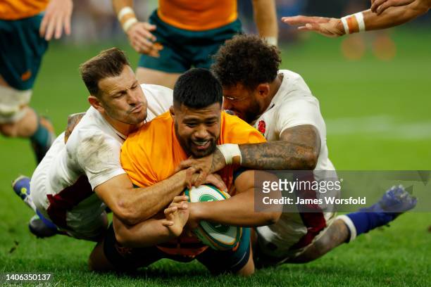 Folau Fainga’a of the Wallabies gets over the try line to score a try during game one of the international test match series between the Australian...