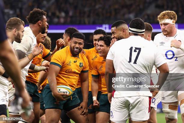 Folau Fainga'a of the Wallabies celebrates scoring a try with team mates during game one of the international test match series between the...