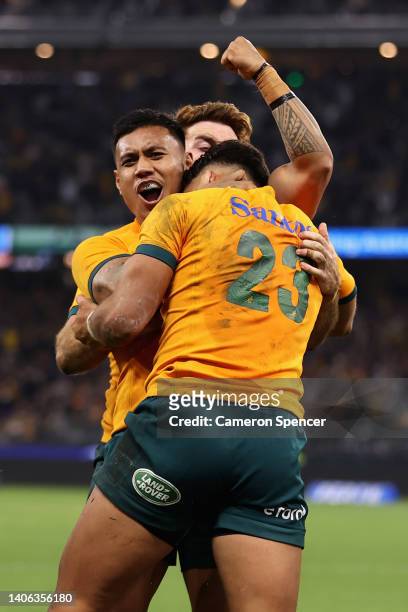 Jordan Petaia of the Wallabies celebrates scoring a try with team mates during game one of the international test match series between the Australian...