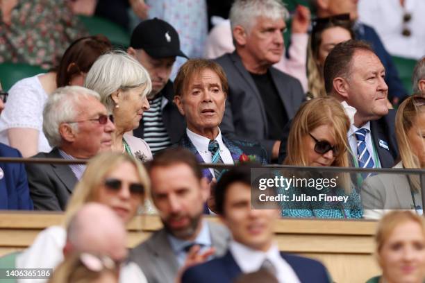 Singer, Sir Cliff Richard looks on from the stands before Coco Gauff of The United States plays against Amanda Anisimova of The United States during...