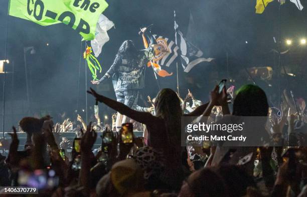 The crowds cheer as Billie Eilish performs on the main Pyramid Stage at the 2022 Glastonbury Festival during day three of the Glastonbury Festival at...