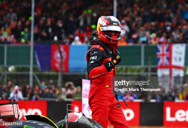 Pole position qualifier Carlos Sainz of Spain and Ferrari celebrates in parc ferme during qualifying ahead of the F1 Grand Prix of Great Britain at...