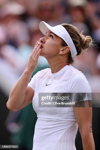 Simona Halep of Romania celebrates after winning match point against Magdalena Frech of Poland during their Women's Singles Third Round match on day...