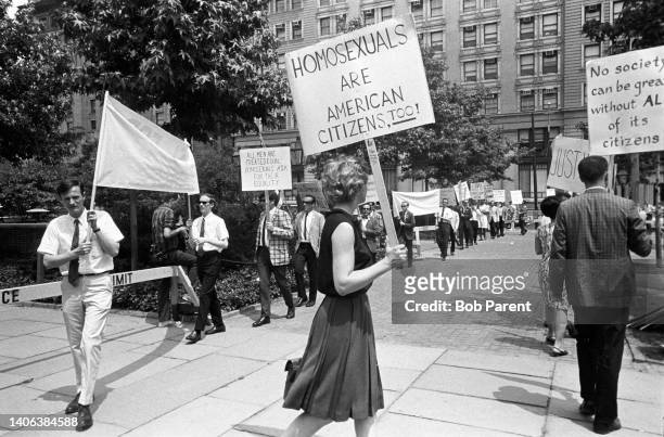 Protesters picket outside of Independence Hall for the 1966 Annual Reminder for homosexual civil rights in Philadelphia, Pennsylvania. One woman...