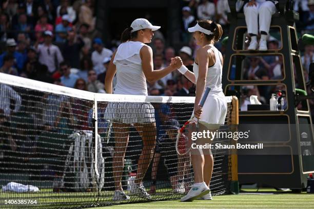 Alize Cornet of France and Iga Swiatek of Poland shake hands following their Women's Singles Third Round match on day six of The Championships...