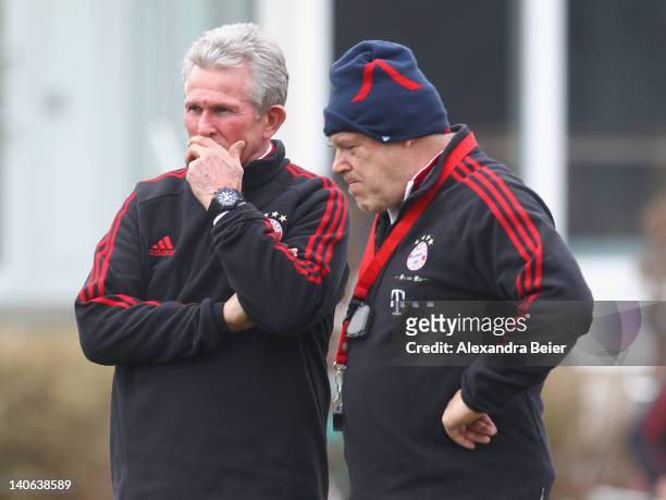 Team coach Jupp Heynckes and assistent coach Hermann Gerland of Bayern Muenchen chat during a training session on March 4, 2012 in Munich, Germany.