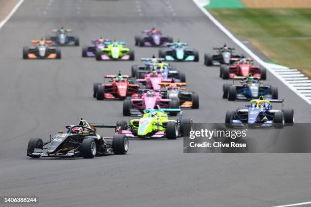 Jamie Chadwick of Great Britain and Jenner Racing leads the field into turn one at the start during the W Series Round 3 race at Silverstone on July...