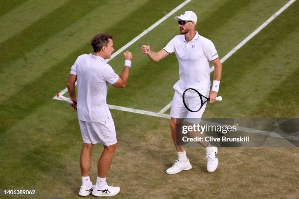 Bruno Soares of Brazil and partner Jamie Murray of Great Britain celebrate a point against Nikola Cacic of Serbia and Andrea Vavassori of Italy...