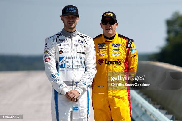 Todd Gilliland, driver of the Ruedebusch Dev. & Construction Ford, . And Michael McDowell, driver of the Love's Travel Stops Ford, wait on the grid...