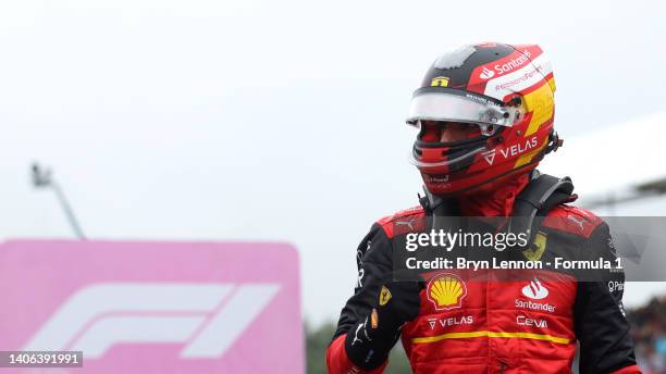 Pole position qualifier Carlos Sainz of Spain and Ferrari celebrates in parc ferme during qualifying ahead of the F1 Grand Prix of Great Britain at...