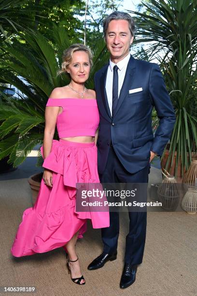 Caroline Roux and Laurent Solly attend the "Ondes Et Merveilles De Chaumet - New High Jewellery Collection" : photocall at Piscine Molitor on July...
