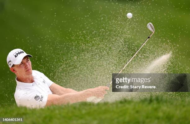 Maverick McNealy of the United States plays a shot from a bunker on the ninth hole during the third round of the John Deere Classic at TPC Deere Run...