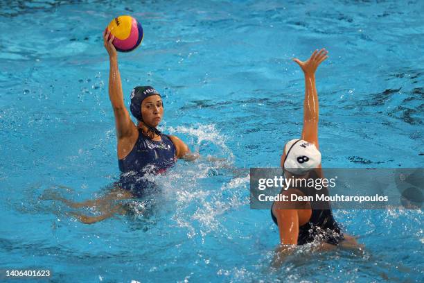 Rita Keszthelyi of Team Hungary controls the ball against Ryann Neushul of Team United States during the Women's Water Polo Gold medal match between...