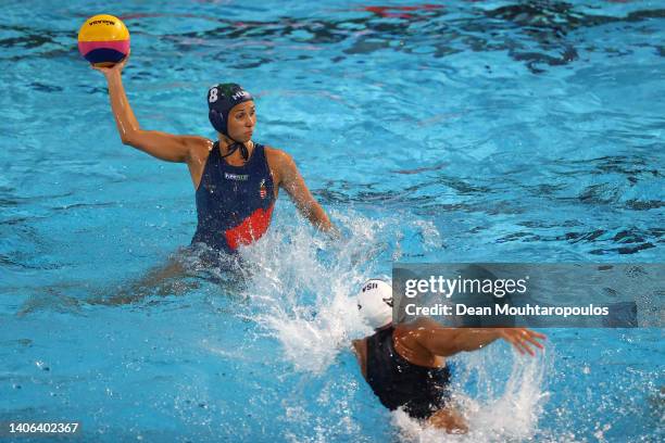 Rita Keszthelyi of Team Hungary shoots the ball against Rachel Fattal of Team United States during the Women's Water Polo Gold medal match between...