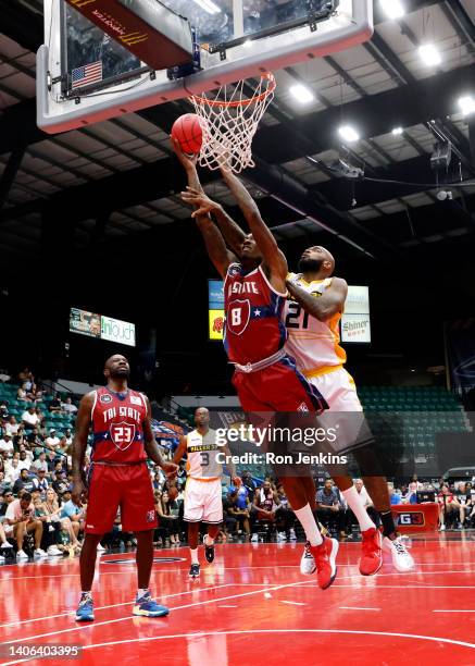 Larry Sanders of the Tri-State drives to the basket against Josh Powell of the Killer 3's during the game in BIG3 Week Three at Comerica Center on...