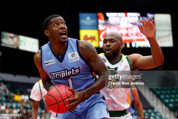 Joe Johnson of the Triplets drives to the basket against Stacy Davis of the Ball Hogs during the game in BIG3 Week Three at Comerica Center on July...